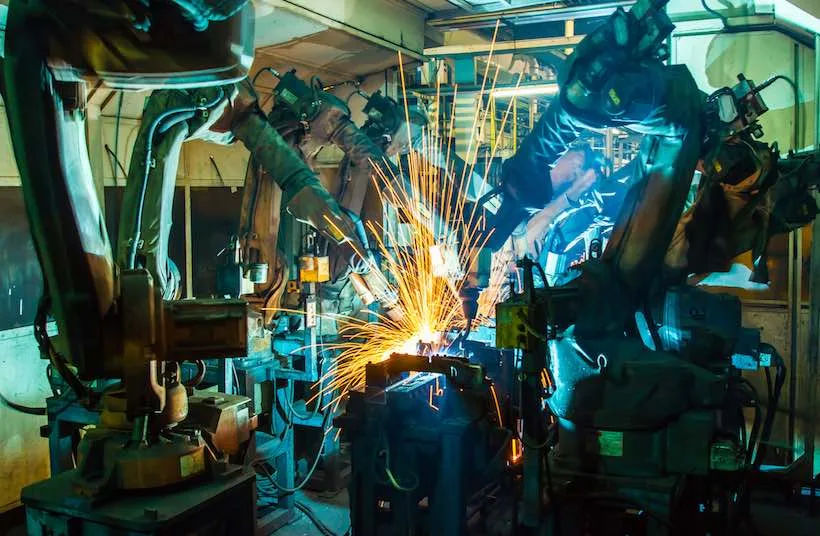 Industrial robots welding on a production line