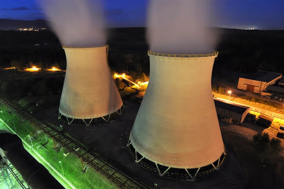 Power station cooling towers at night